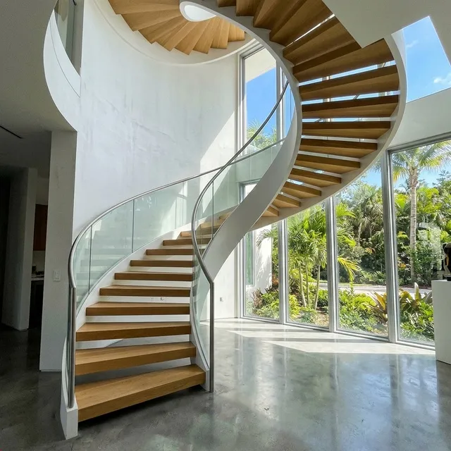 Curved cantilevered staircase with sculptural geometry