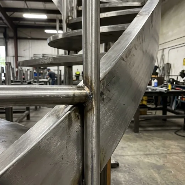 Curved staircase installation with precise structural alignment