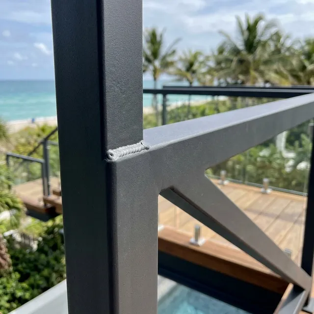 Exterior floating stair installation at a residential entryway