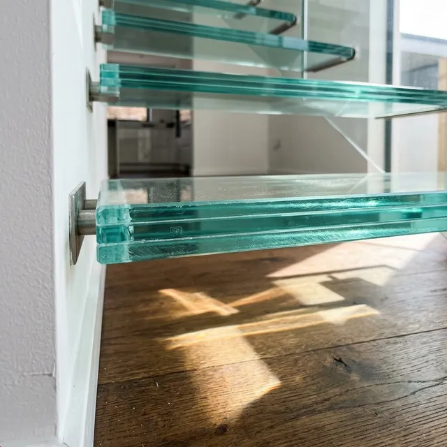 Completed glass tread cantilever staircase in a bright interior